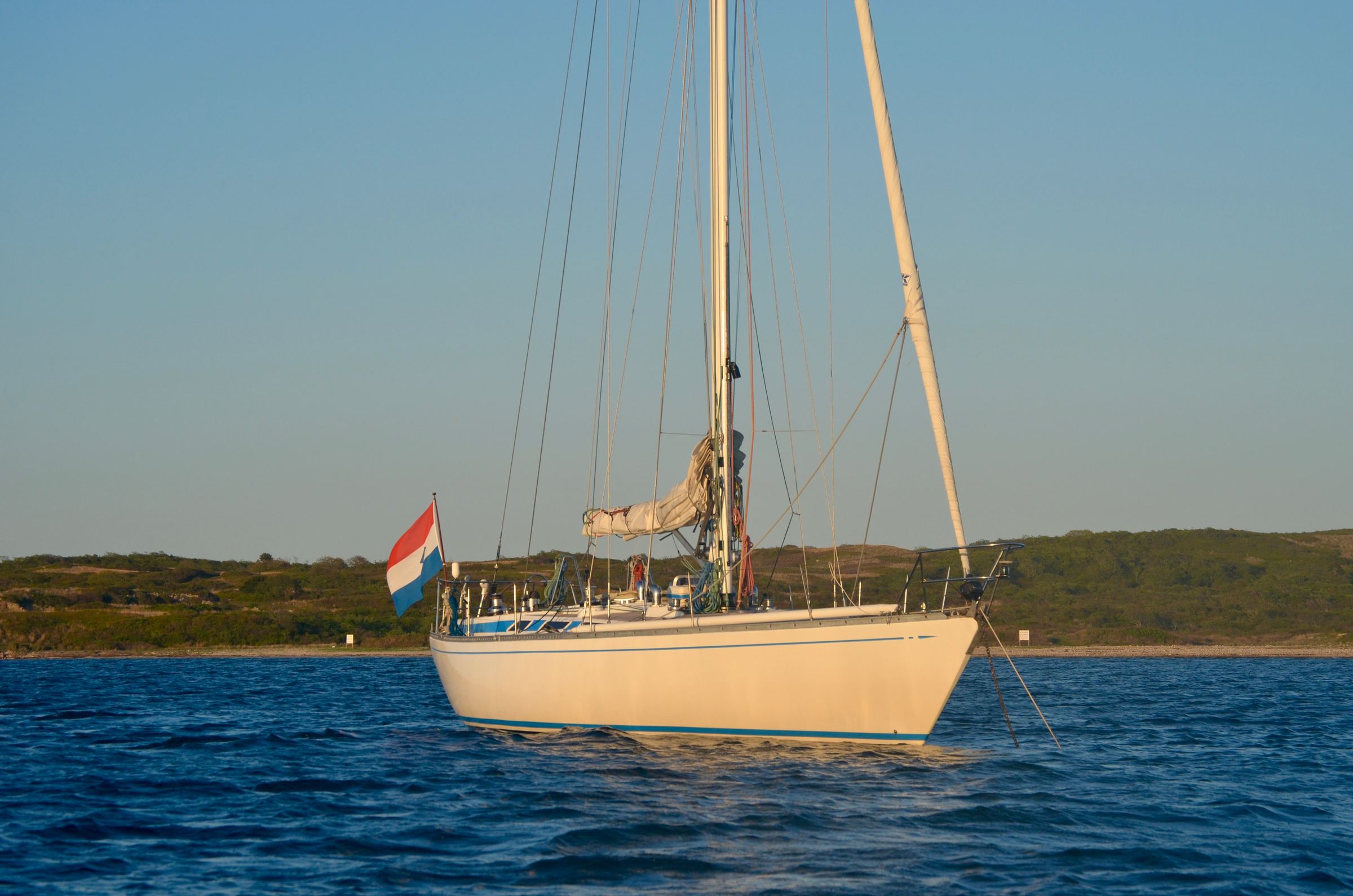 Floortje at anchor flying the Dutch flag