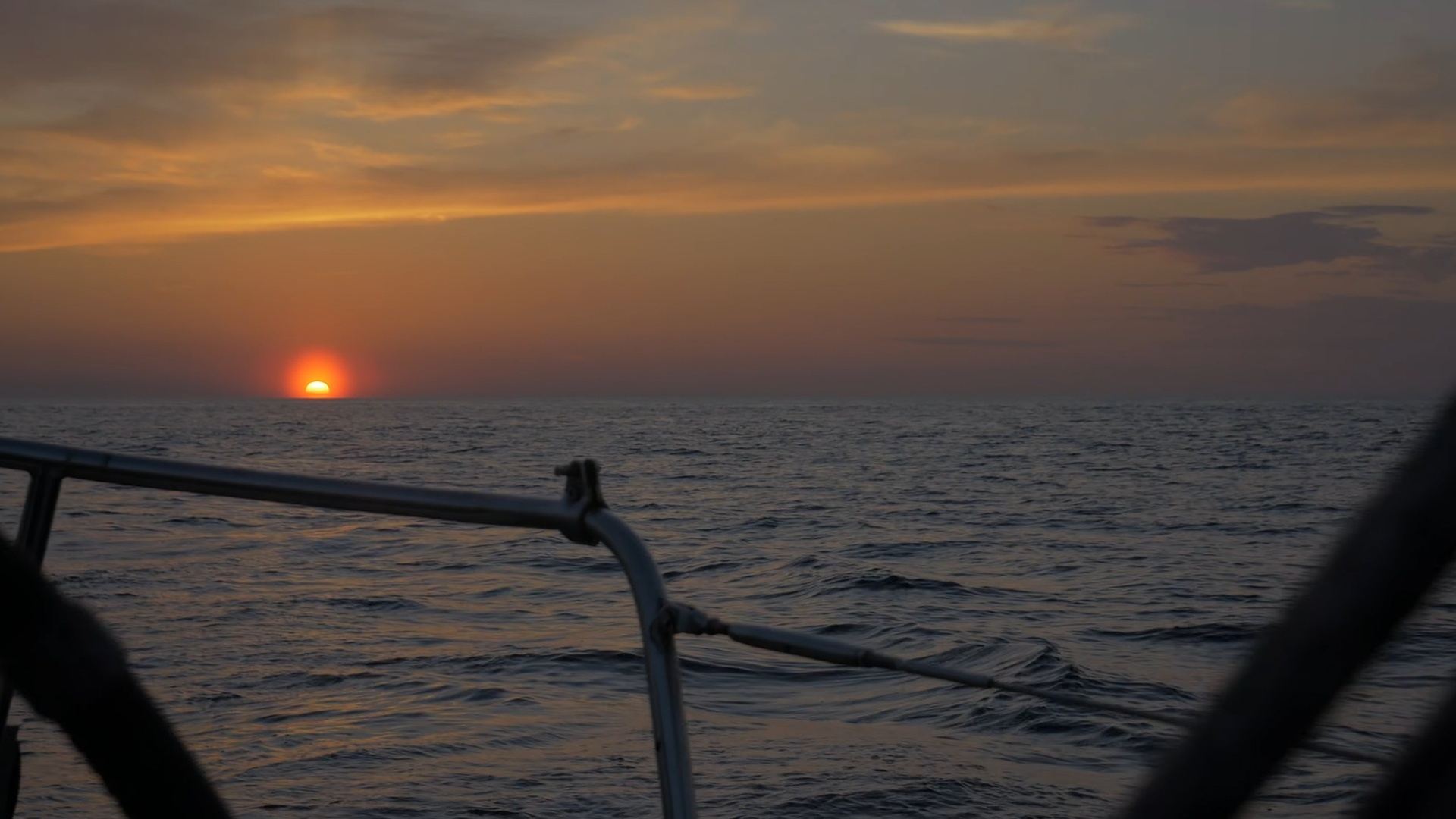 Sunset on the open-sea horizon