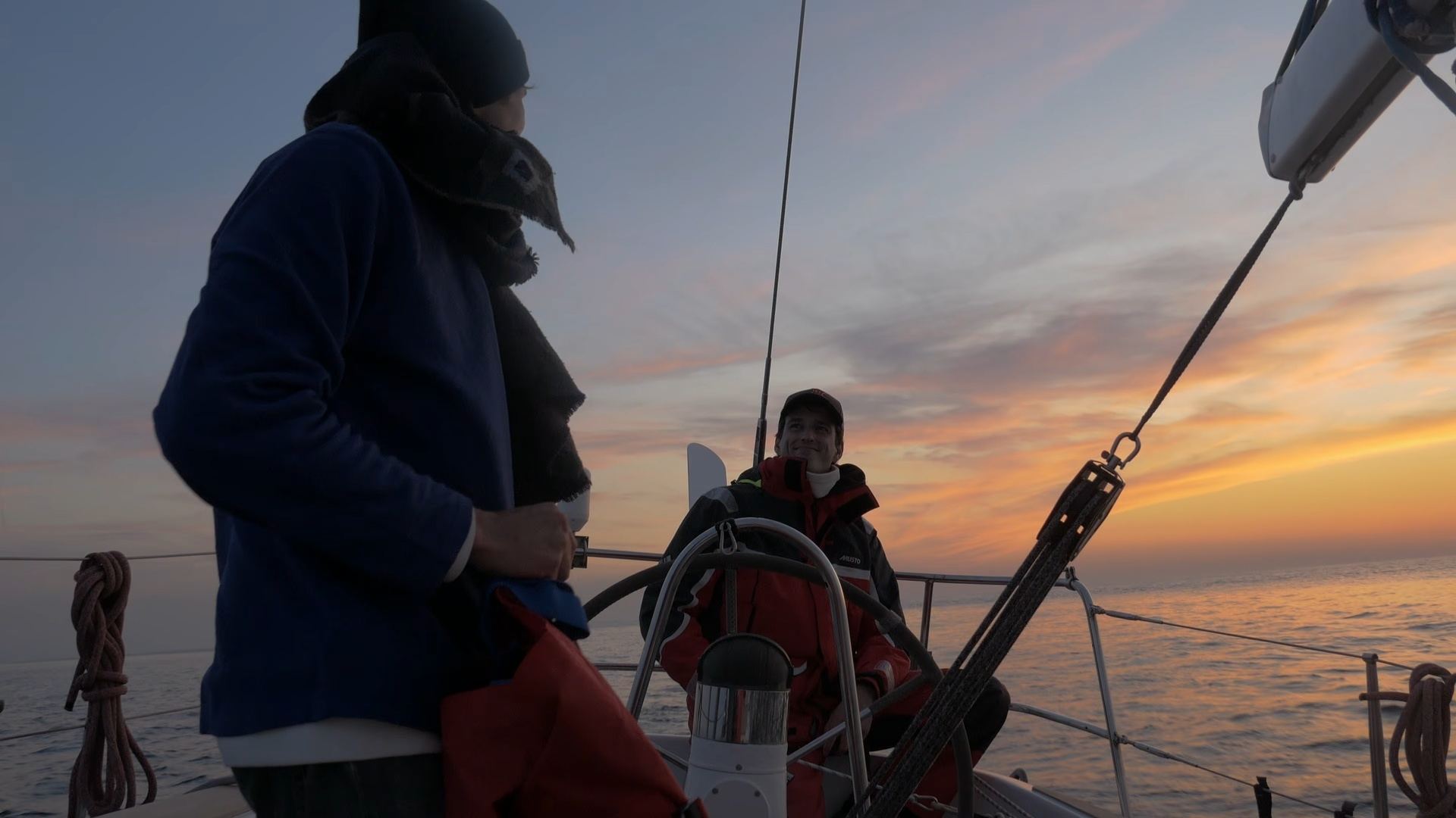 Crew on deck at sunset