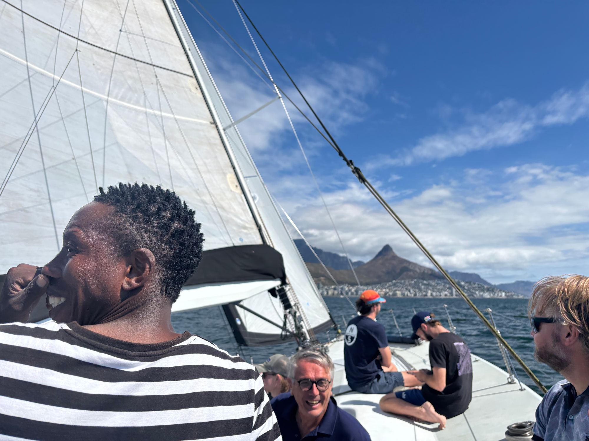 Crew sailing past Table Mountain