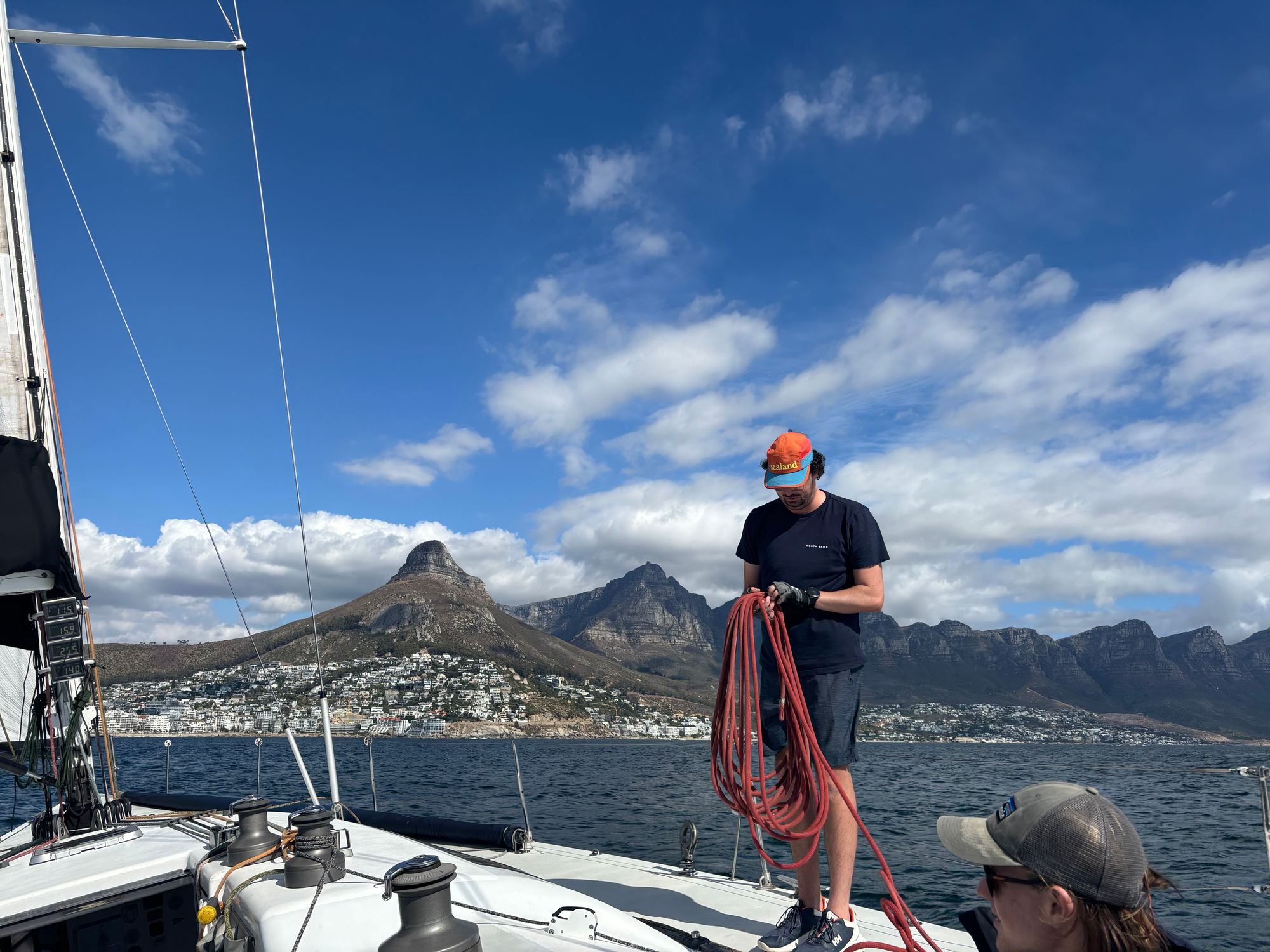 Crew working lines with Lion's Head behind